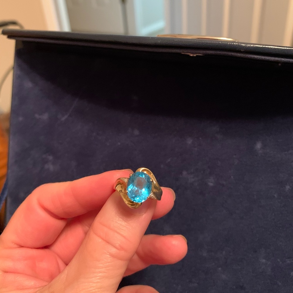 Blue topaz ring with diamond accents in 10k gold